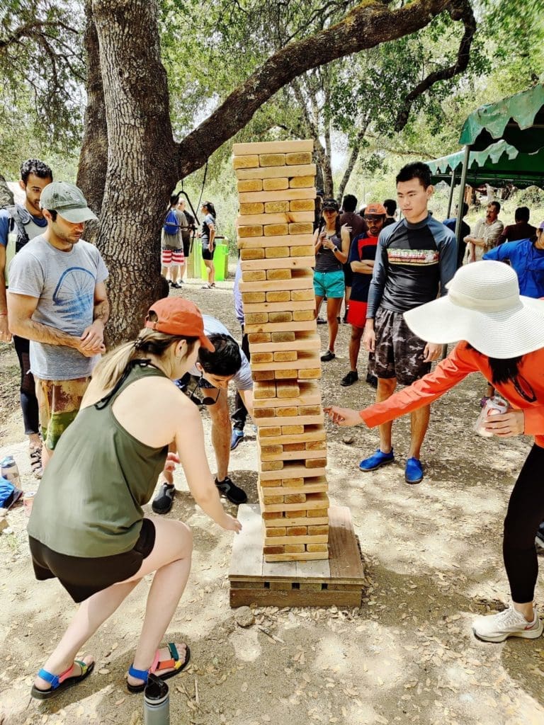 Playing-giant-Jenga-at-Tributarys-south-fork-american-river-camp-scaled.jpg