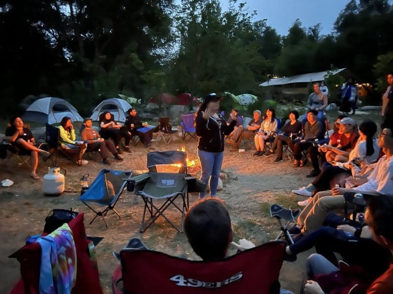 Storytelling by the fire on the American River camp